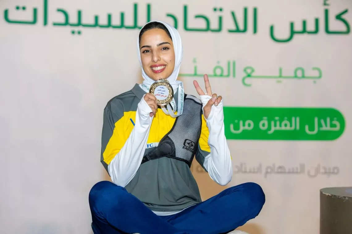Mashail Alotaibi with medal.