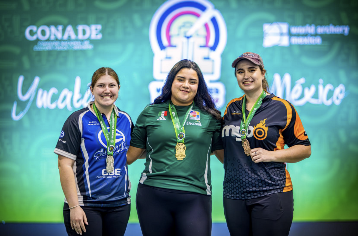 Andrea Becerra on the Merida top podium with silver medallist Alexis Ruiz and bronze medallist Ella Gibson. 