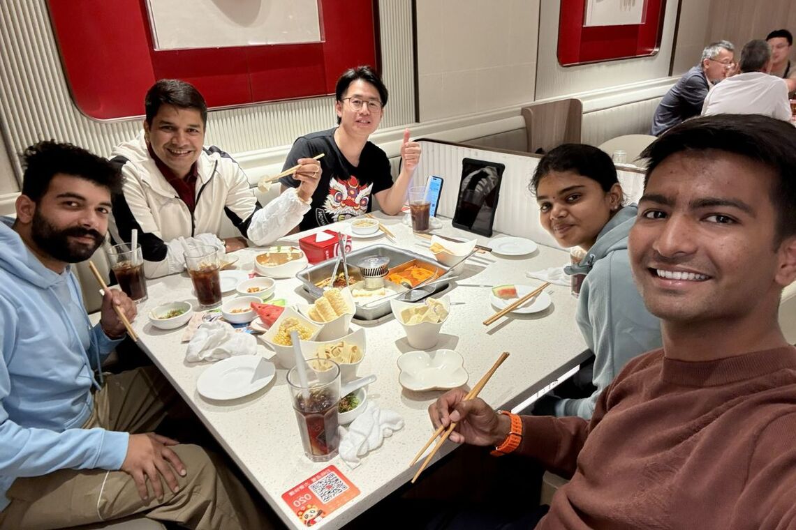 Teammates having food together.