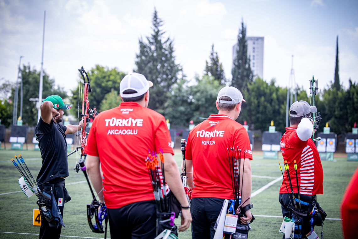 Türkiye's compound men team watching Mexico shoot in the compound men team semifinal.