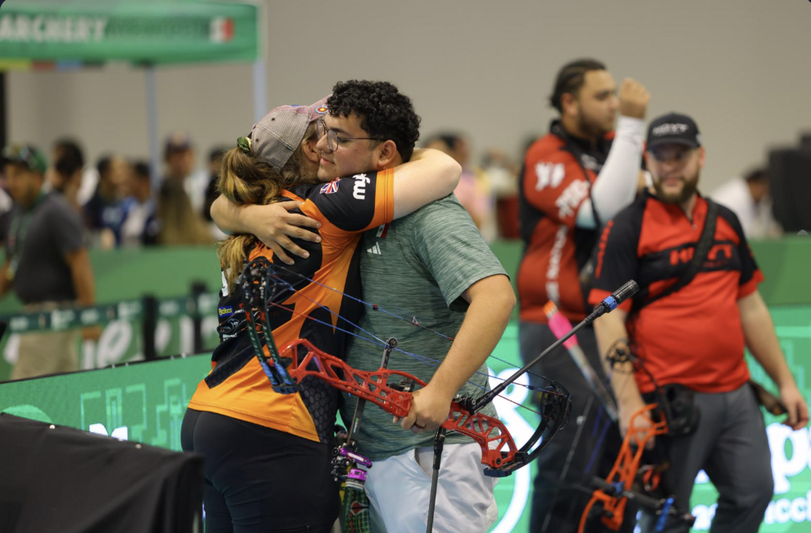 Sebastian Garcia and Ella Gibson hugging each other at Merida 500. 
