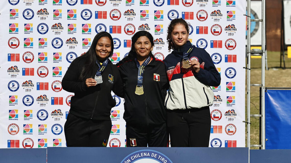 Archers pose on podium