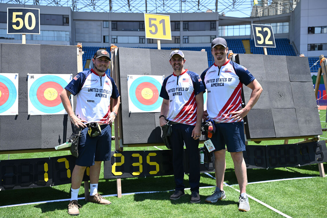 Archer pose after their round