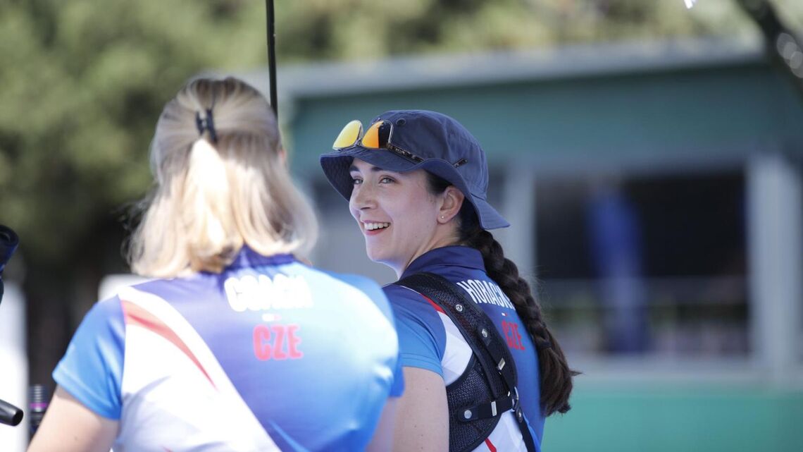 Marie Horackova smiling back at her coach at the 2026 Spring Arrows. 