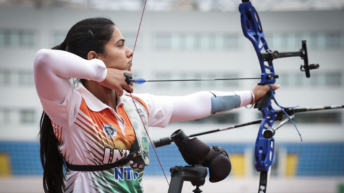 Simranjeet Kaur aiming at the Yuanshen Sports Centre during recurve women eliminations at Shanghai 2026.