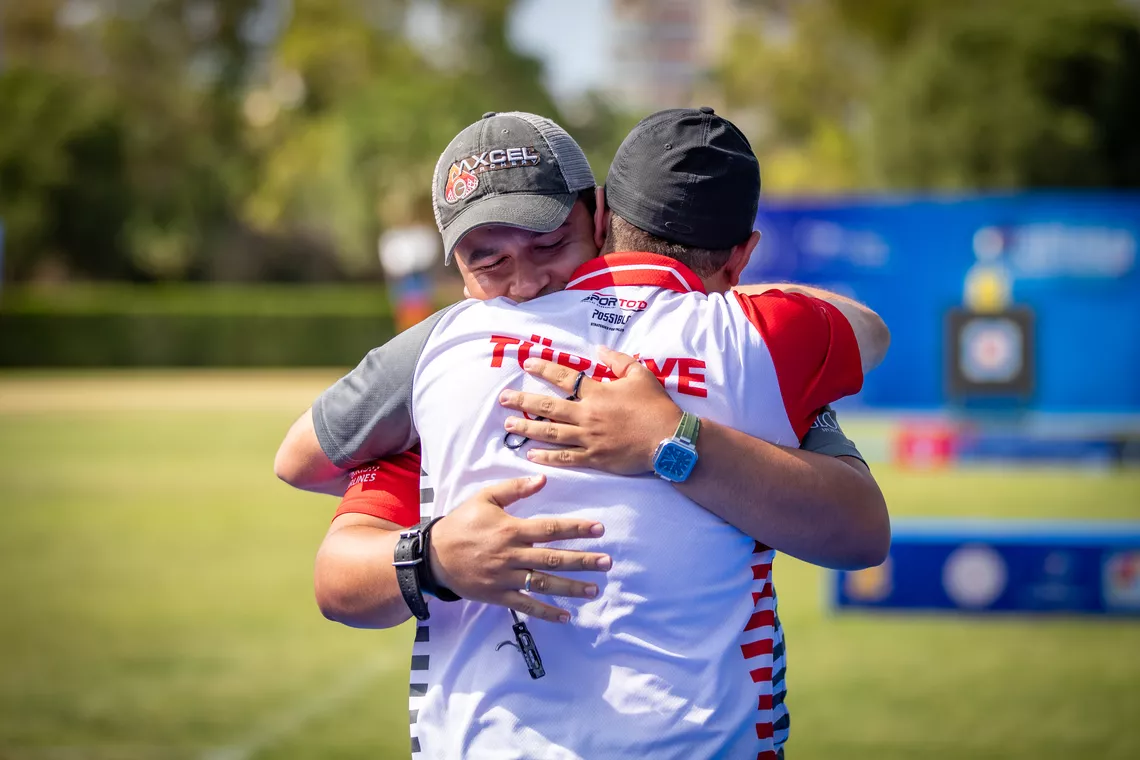 Emircan Haney hugging his coach after winning gold at the 2026 European Championships.