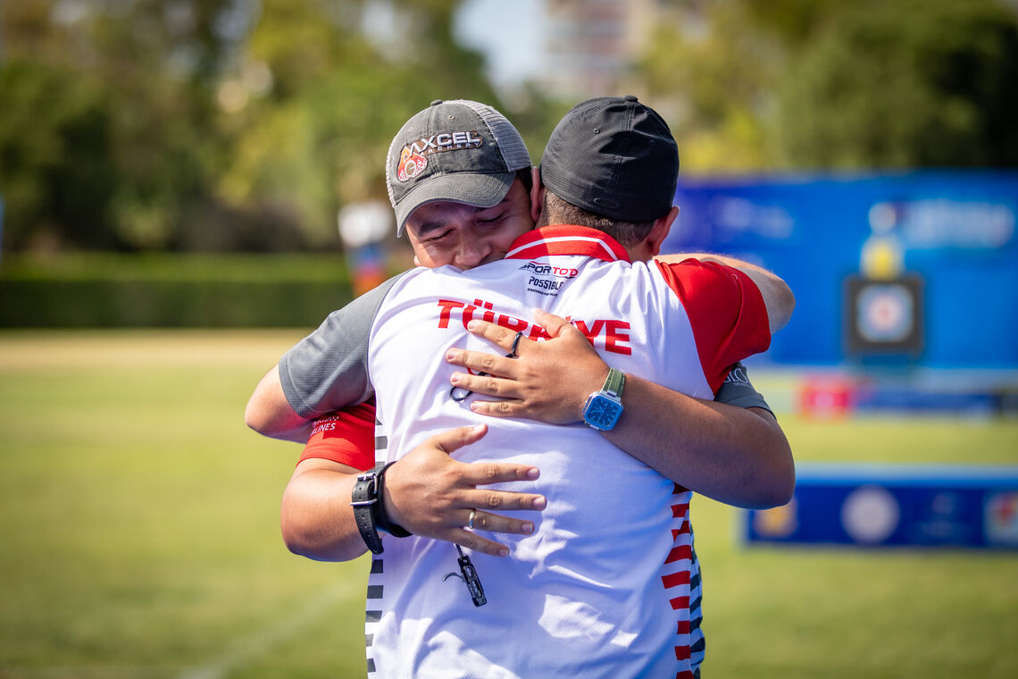 Emircan Haney hugging his coach after winning gold at the 2026 European Championships.