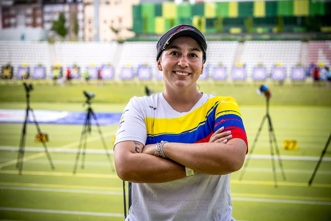 Sara Lopez crossing her arms smiling as she poled early at Madrid 2026.