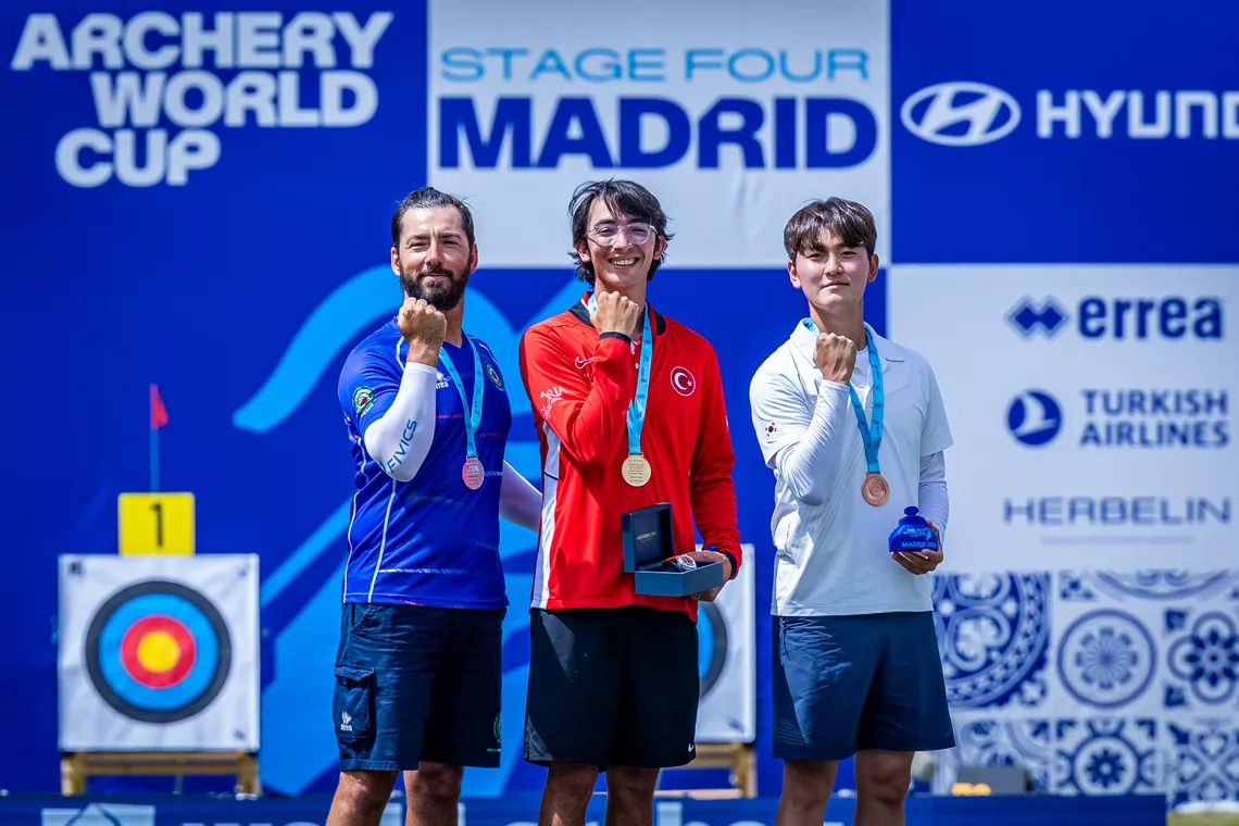 Mauro Nespoli, Mete Gazoz and Kim Je Deok on recurve men’s podium at Madrid 2026.