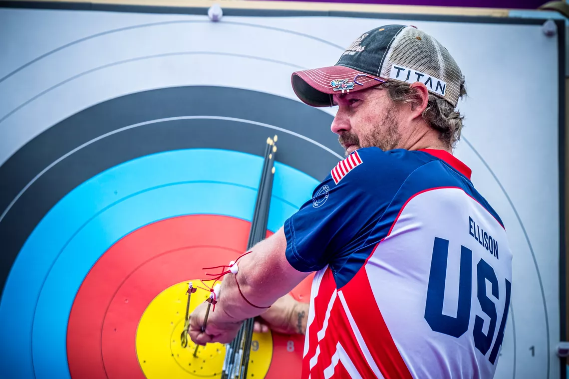 Brady Ellison pulling out arrows.
