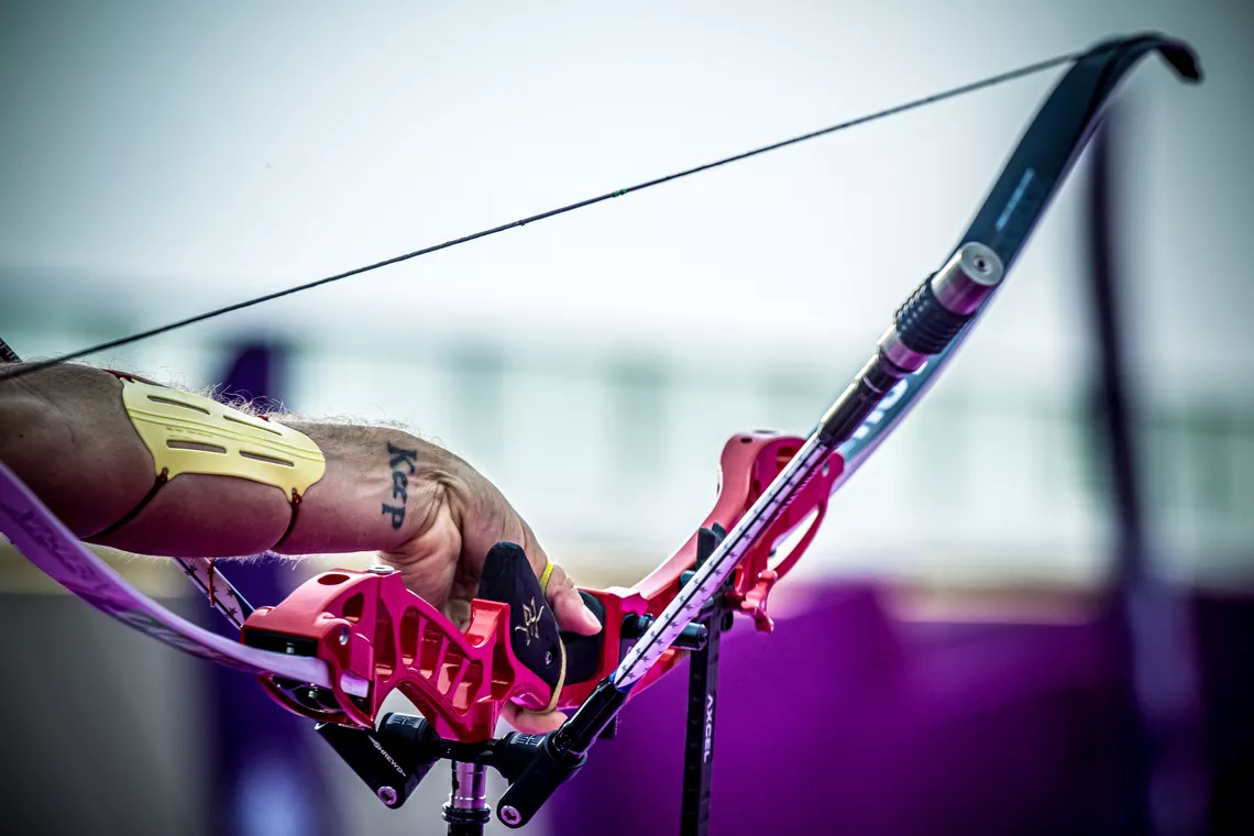 Archer's hand during release of an arrow. 