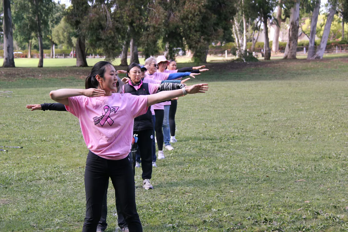 Katherine Wu teaching form at an Archery RX class.