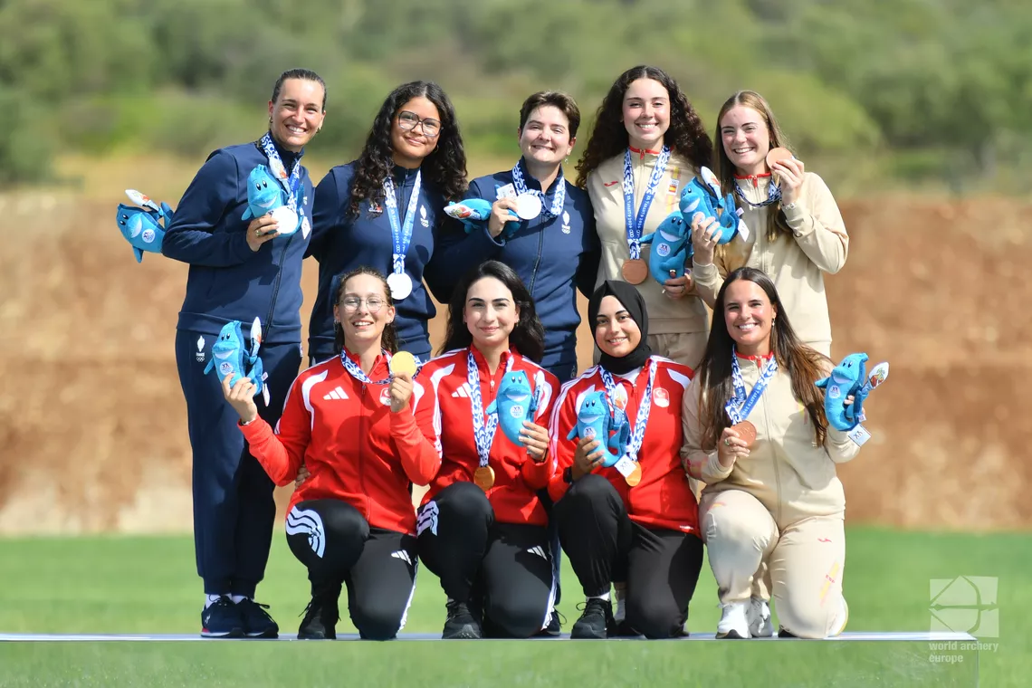 Medalists pose on the podium