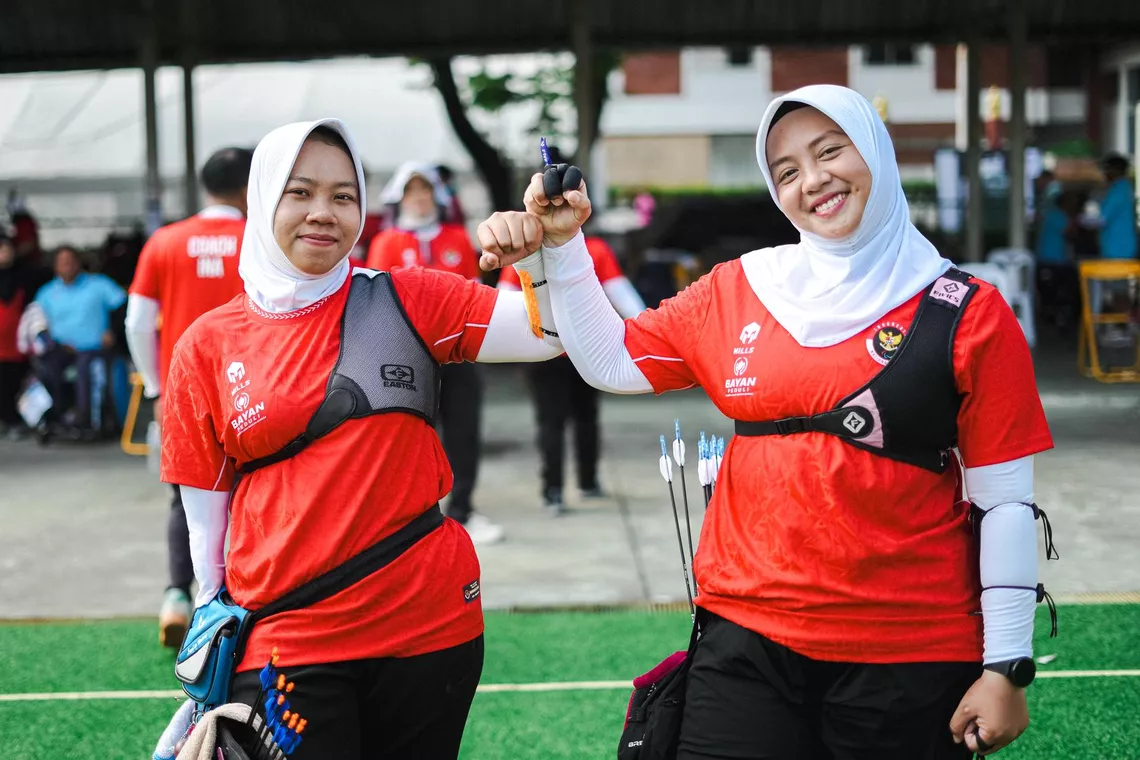 Athletes celebrate after the round