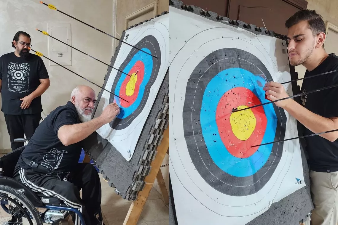 Jordanian trainee judges practicing measuring arrow distance on target.