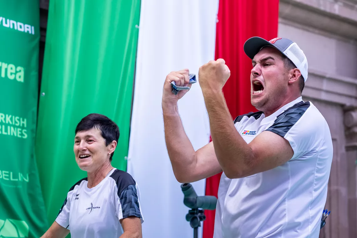 Bettina and Nico Wiener celebrating after winning the 2026 compound men World Cup Final. 