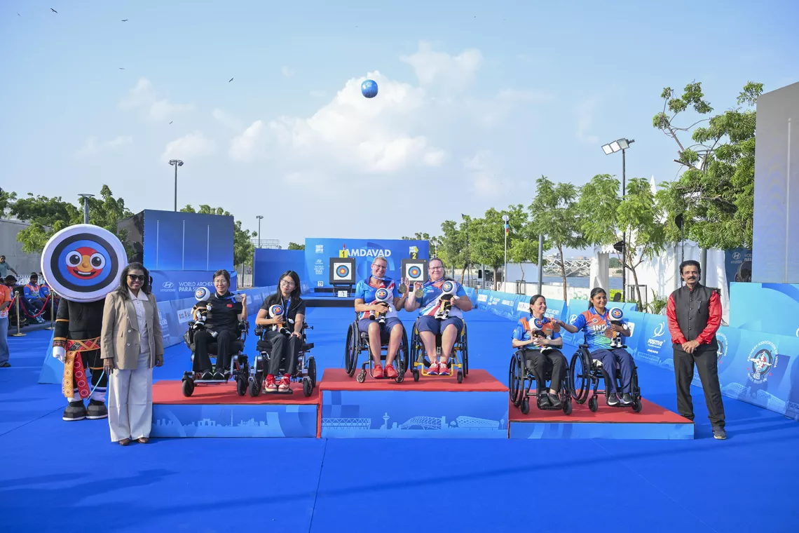 Athletes celebrate on podium