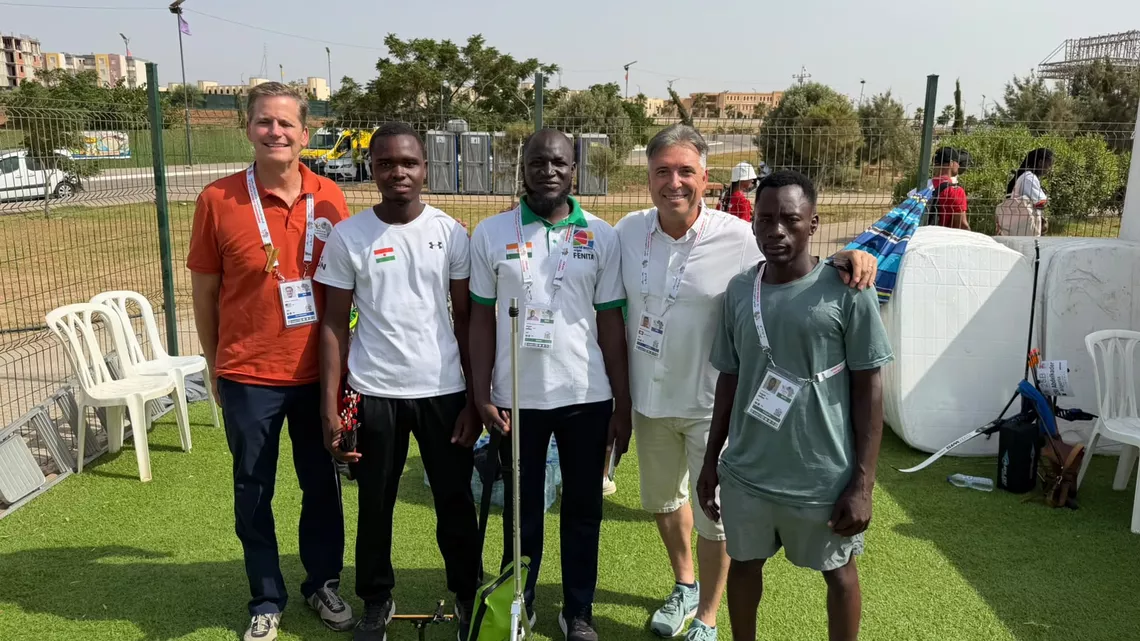 World Archery President Greg Easton and Executive Director Juan Carlos Holgado with Niger team at Oran 2026 African Archery Championships.