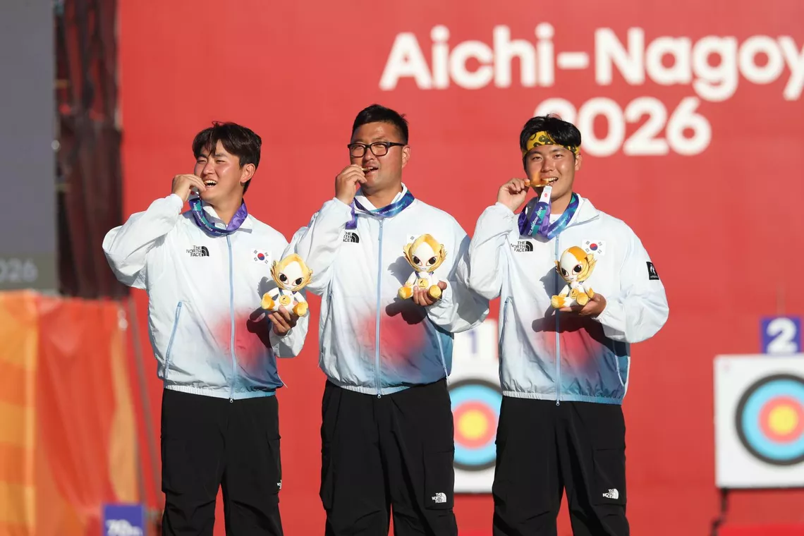 Athletes celebrate on podium