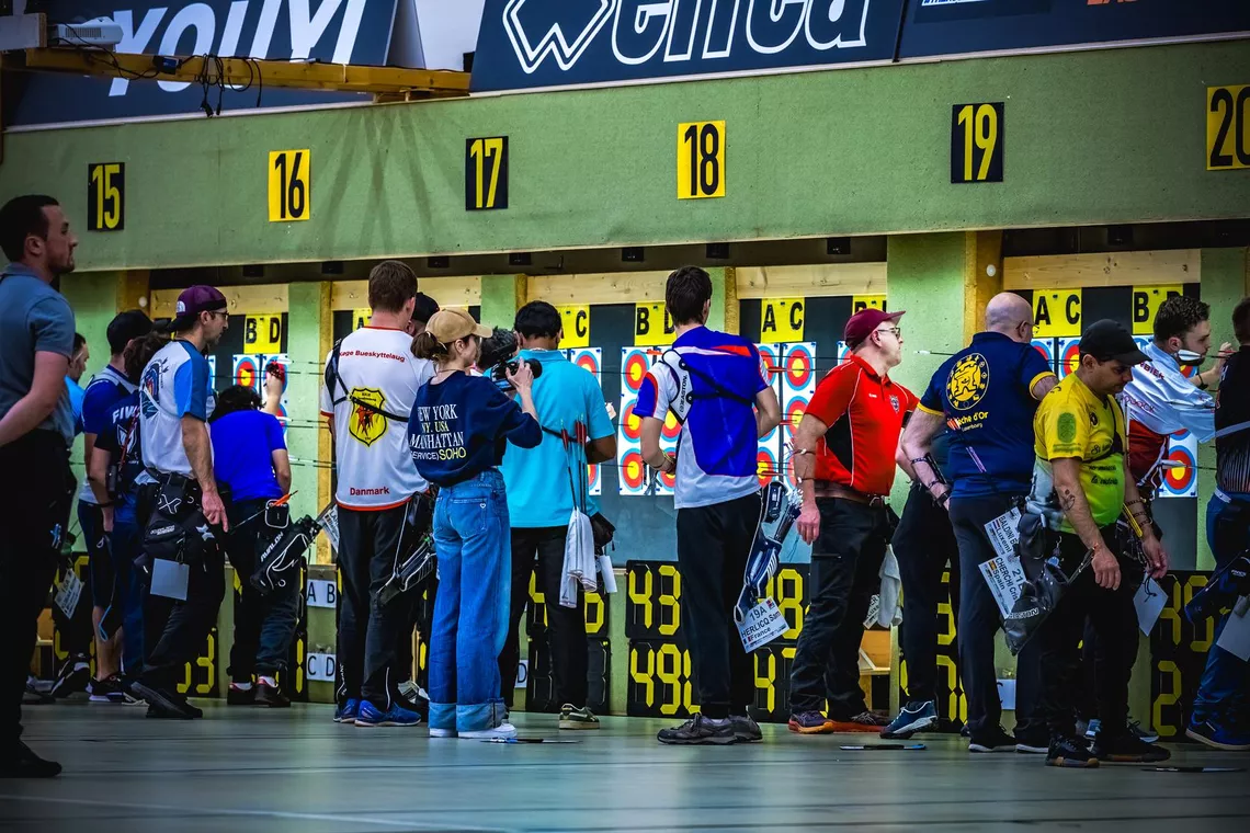 Archers counting scores at the 2025 GT Open. 