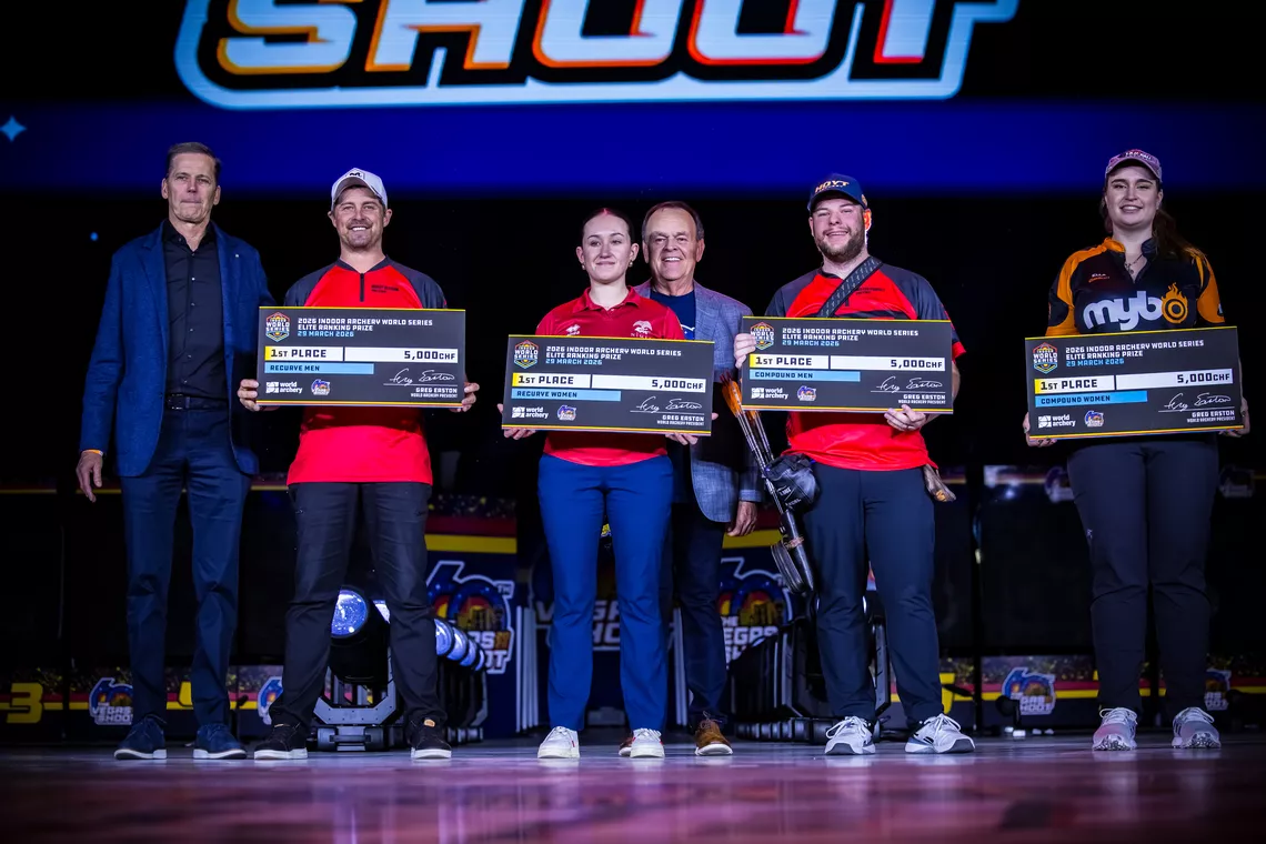 Brady Ellison, Victoria Sebastian, Mike Schloesser and Ella Gibson holding up their cheques after winning the 2025 Indoor World Series.