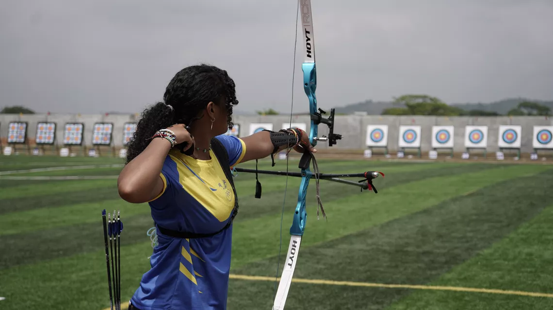 An archer for Ecuador prepares to release their arrow.