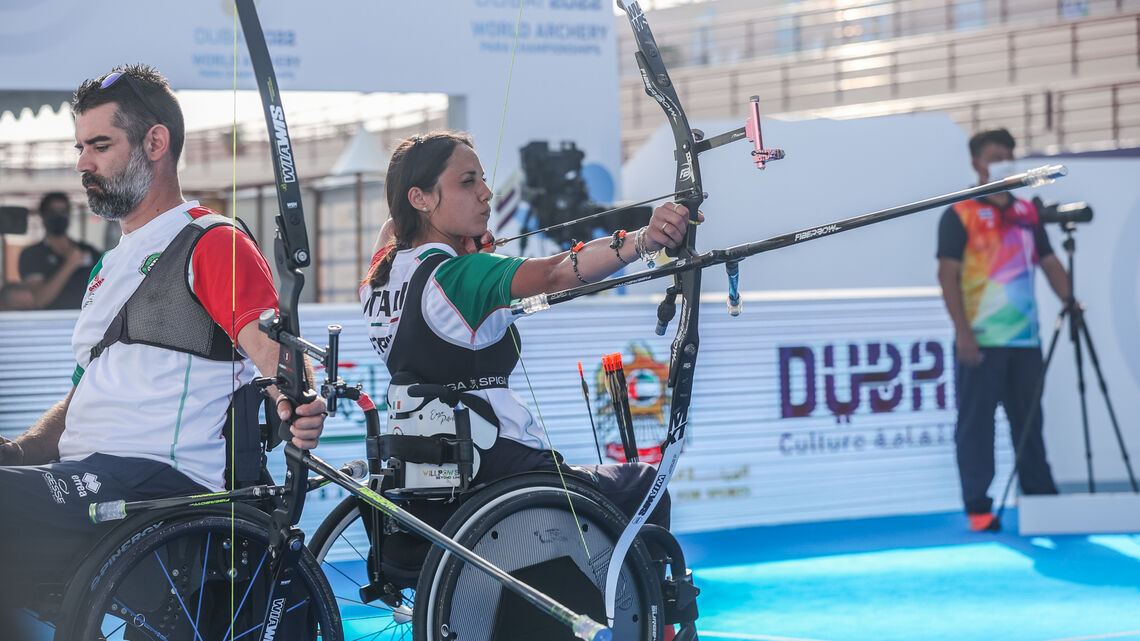 Vincenza Petrilli shoots during the mixed doubles final in Dubai.