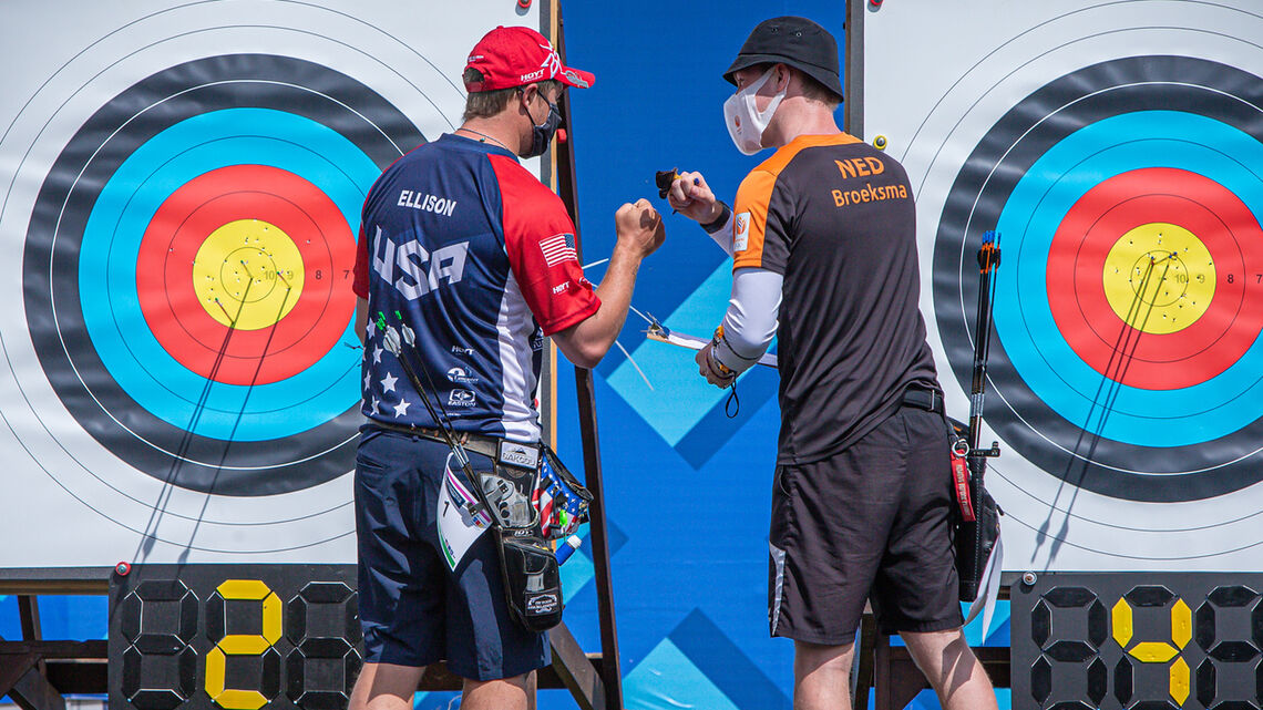 Brady Ellison and Gijs Broeksma bump fists after their eliminations match at the first stage of the 2021 Hyundai Archery World Cup in Guatemala City.