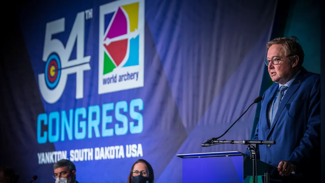 Tom Dielen speaks at the World Archery Congress in 2021.