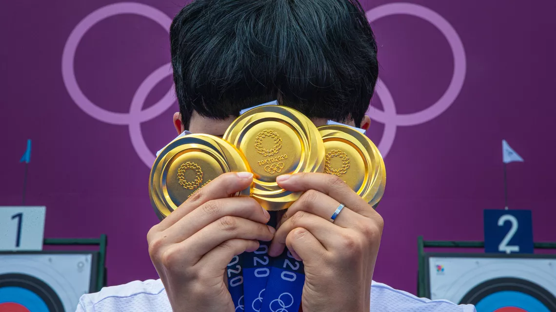 An San with her three Olympic gold medals.