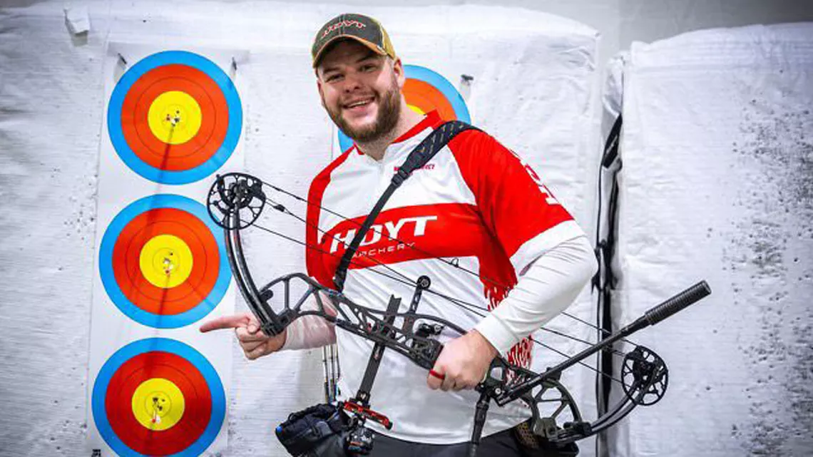 Schloesser poses with 25-metre record face.