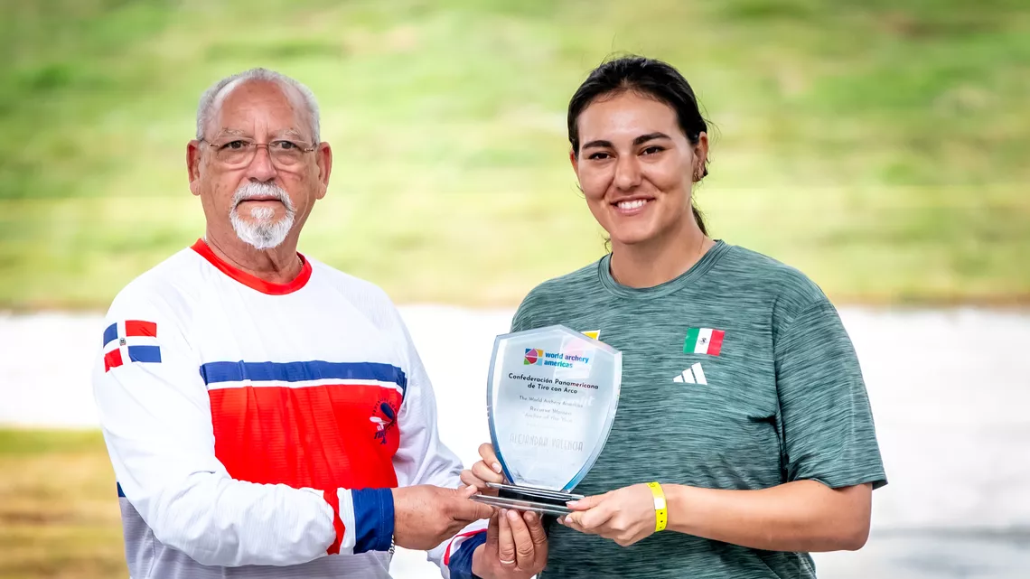 Alejandra Valencia being awarded the Copa Merengue.