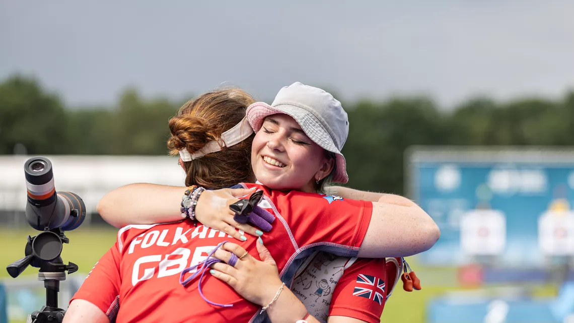 Penny Healey hugging her coach Naomi Folkard. 