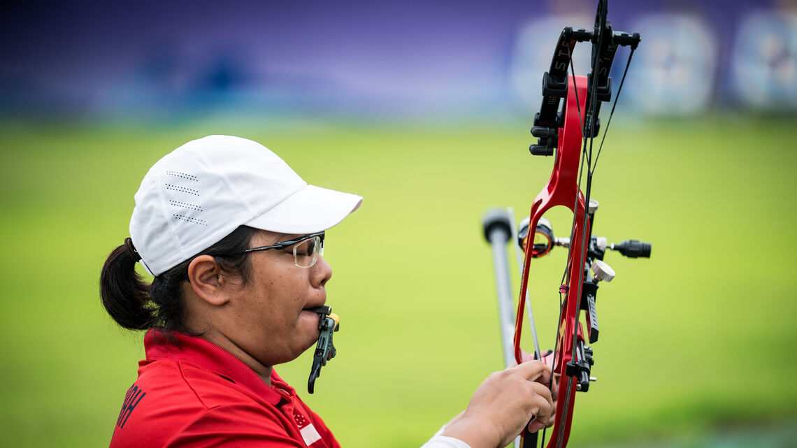 Nur Syahidah Alim checking her bow.