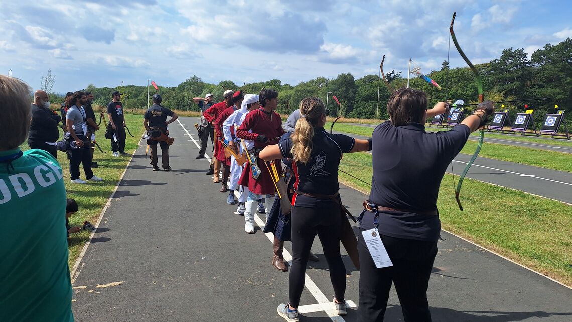 Archers competing in the first British national thumb draw competition.