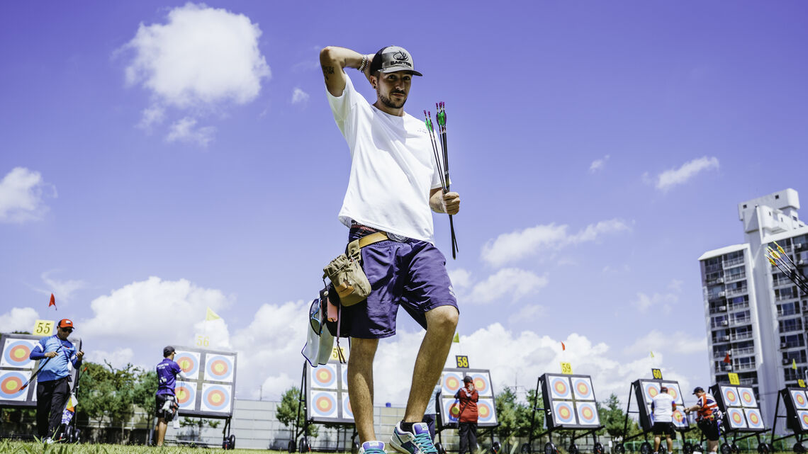 Nicolas Girard scratching his head on the field.