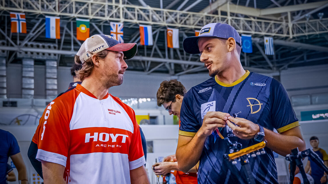 Brady Ellison and Marcus D'Almeida speaking to one another.