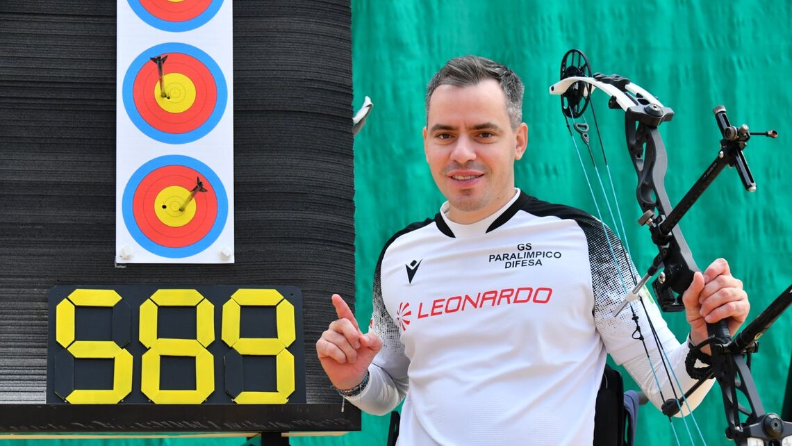 Paolo Tonon celebrating next to the target.