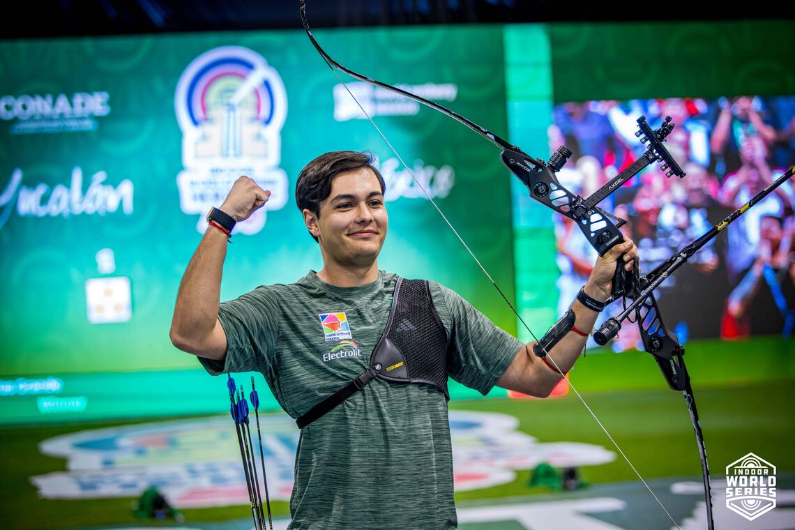 An archer celebrates with his bow