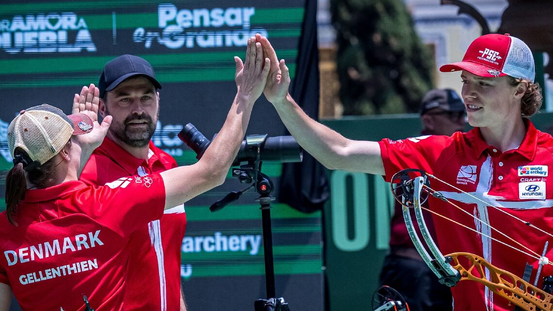 Tanja Gellenthien and Mathias Fullerton high-fiving after winning gold at Puebla 2026.