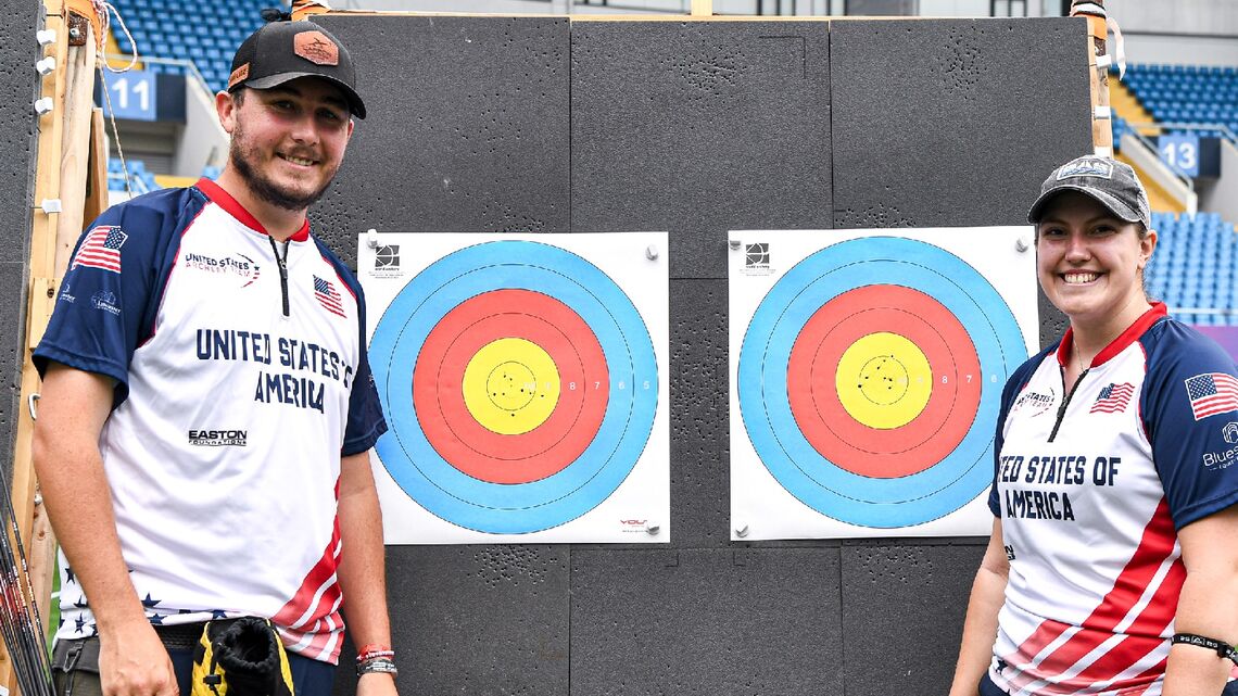 James Lutz and Alexis Ruiz smiling at their winning targets at Shanghai 2026. 