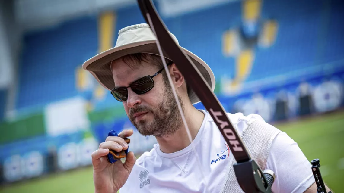 Jean Charles Valladont about to take his sunglasses off after firing a shot in Shanghai.