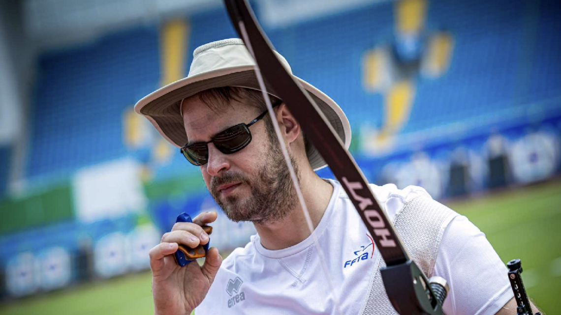 Jean Charles Valladont about to take his sunglasses off after firing a shot in Shanghai.