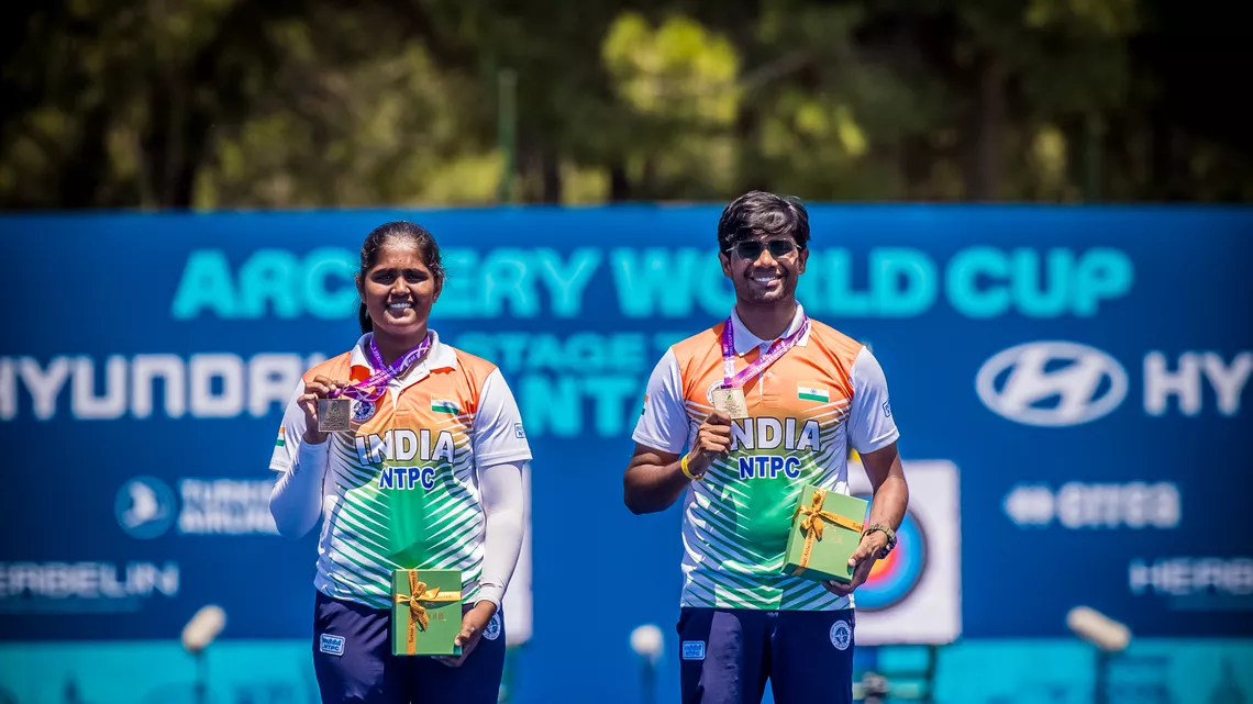 Kumkum Anil Mohod and Dhiraj Bommadevara holding up their gold medals at Antalya 2026.