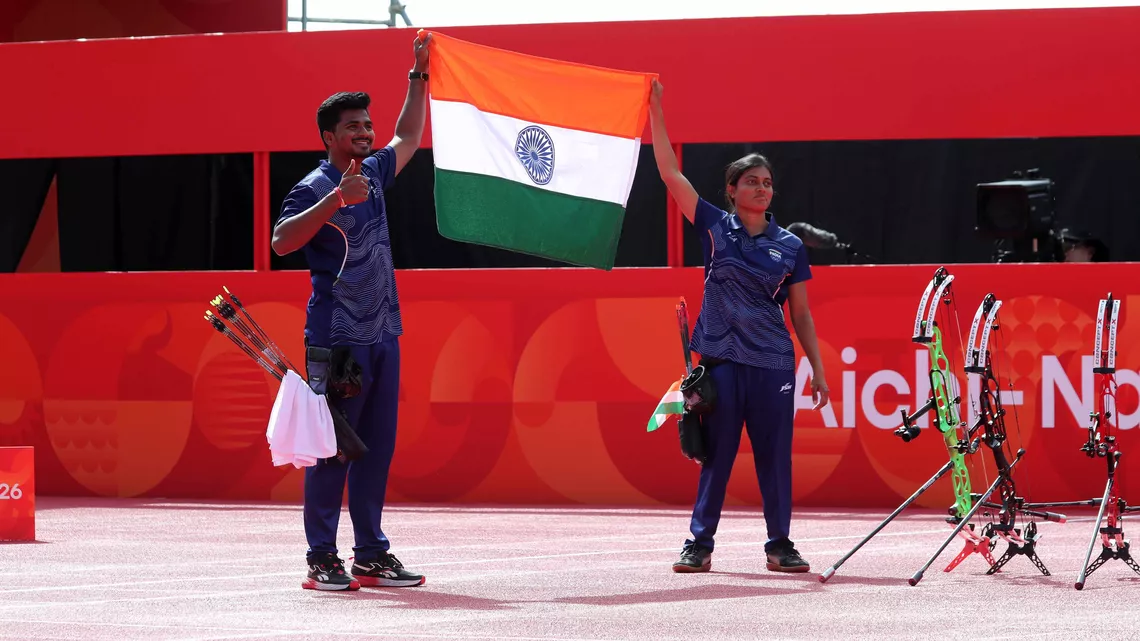 Athletes celebrate with country flag