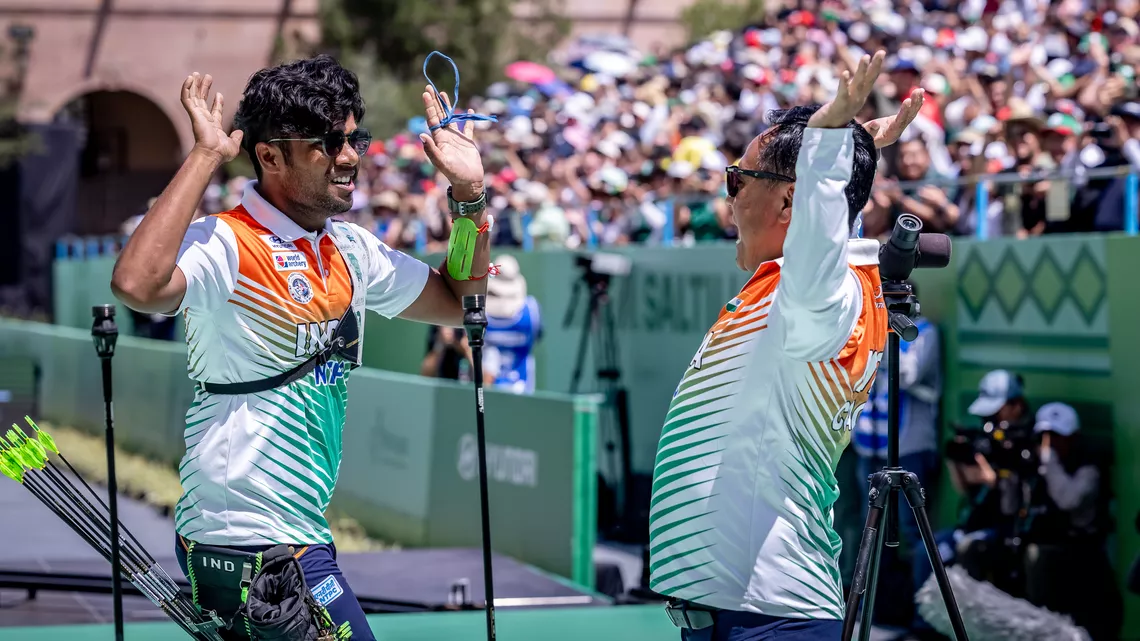 Dhiraj Bommadevara high fiving his coach after winning the Saltillo 2026 World Cup Final.