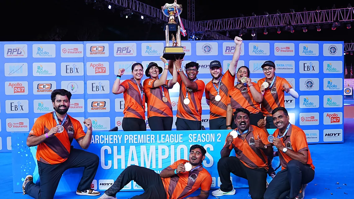 Athletes celebrate with trophy after their victorious campaign 
