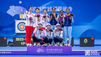 The recurve women’s team podium at the Asian Games.