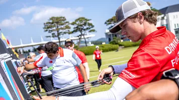 Mathias Fullerton draws arrows from the target in Yecheon.