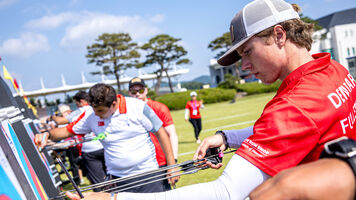 Mathias Fullerton draws arrows from the target in Yecheon.